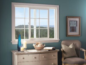 The bedroom of a home with sliding windows installed