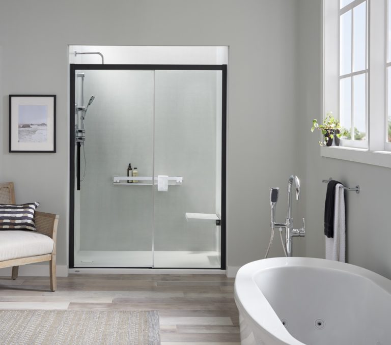 Modern shower space with dark-trimmed enclosure