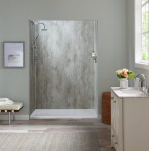 A bathroom having one grey wallpaper, shower.